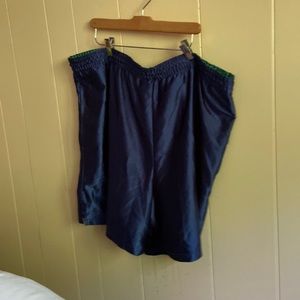 Blue boxer shorts lined with green waist band.